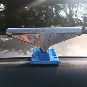 Venture Silver and Blue Skateboard Truck